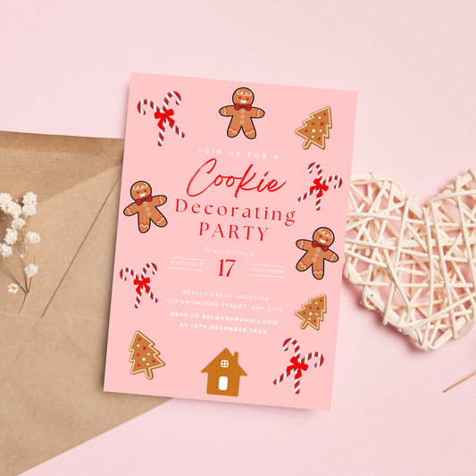 Pink invitation card for a Cookie Decorating Party with gingerbread men and candy cane designs on a pink background.