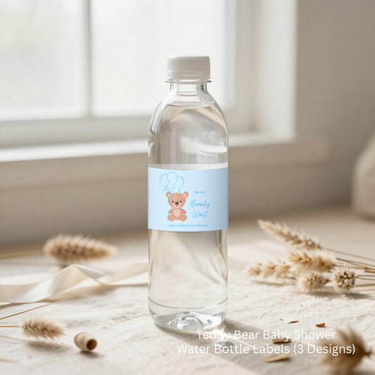 Clear water bottle with a blue label featuring a teddy bear design on a light wooden surface.