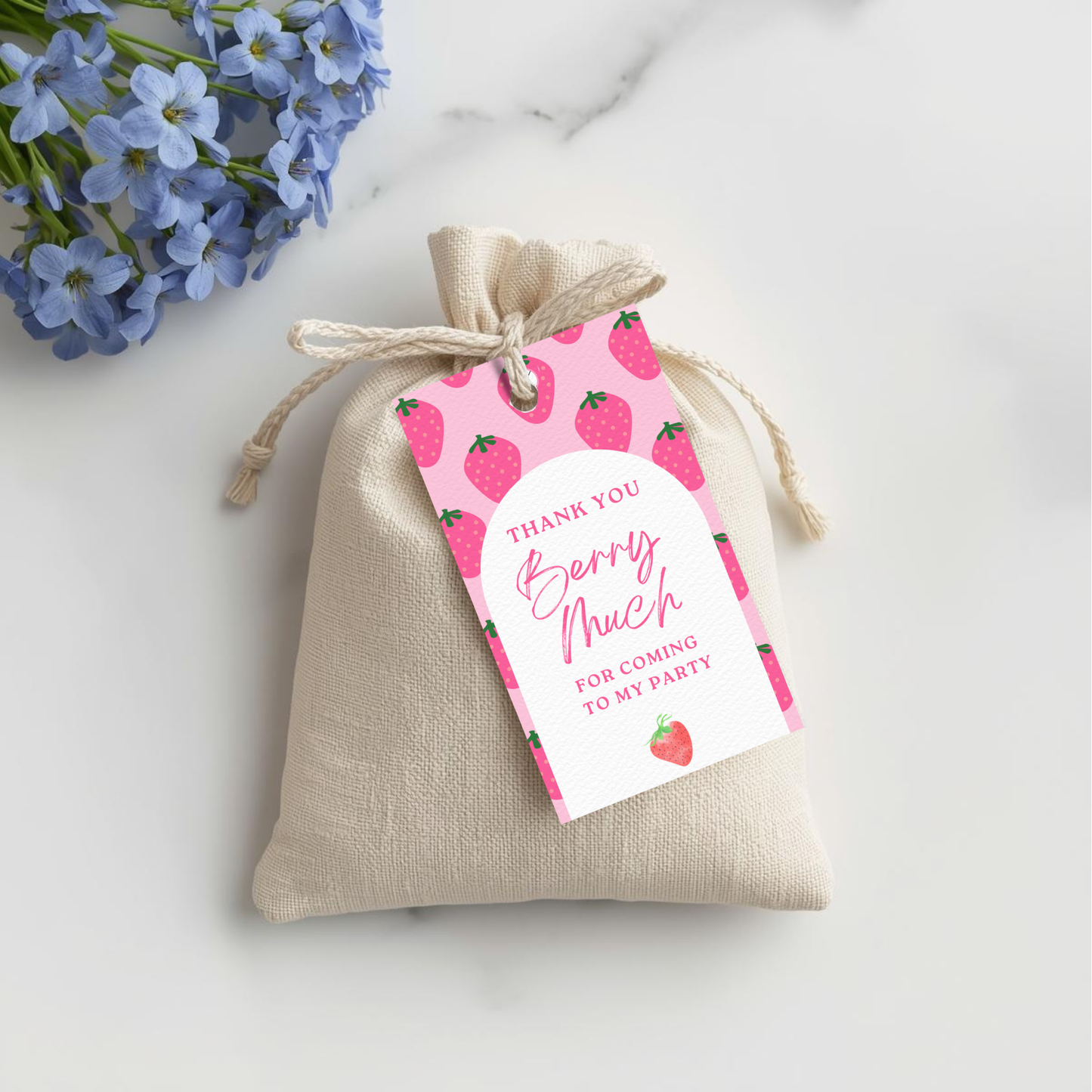 Beige drawstring bag with a pink 'Thank you berry much' tag on a white background