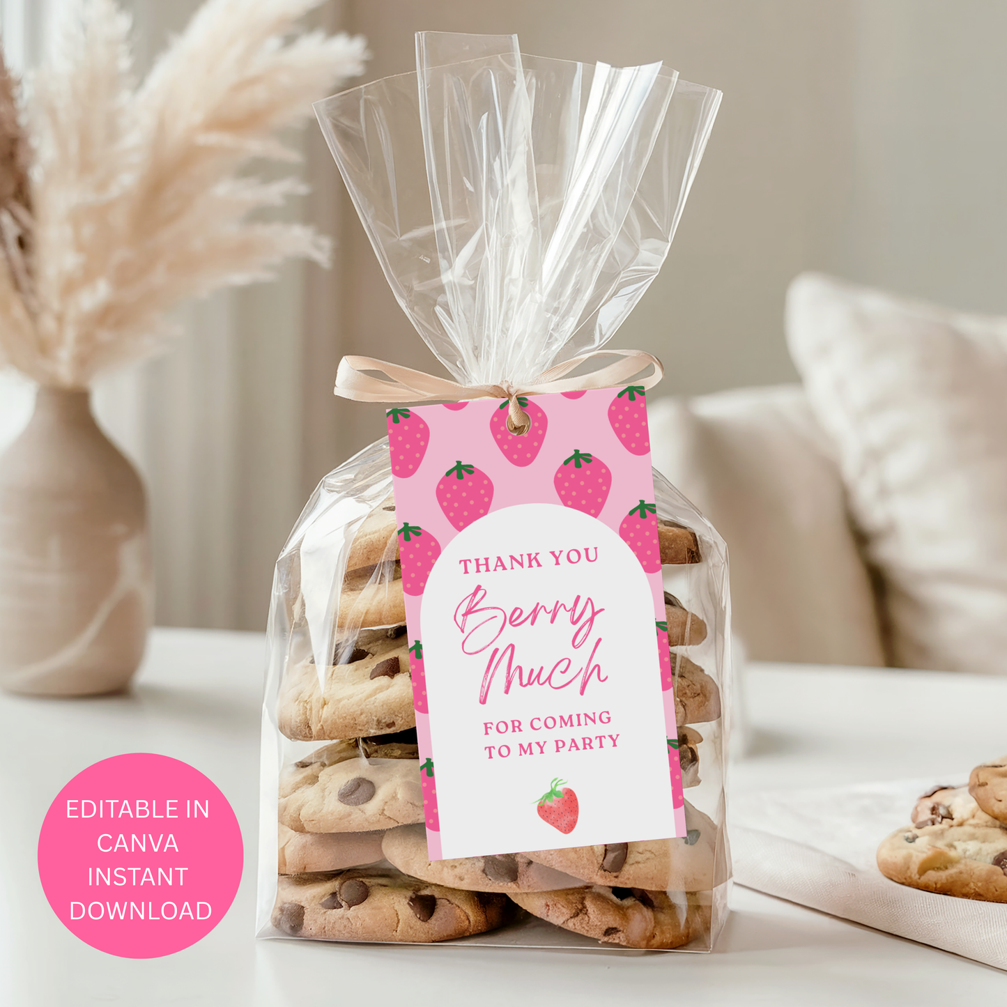 Bag of cookies with a 'Thank you berry much for coming to my party' tag on a neutral background