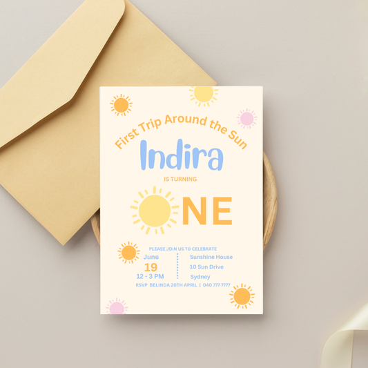 Invitation card for a first birthday party with sun design and envelope on a light background