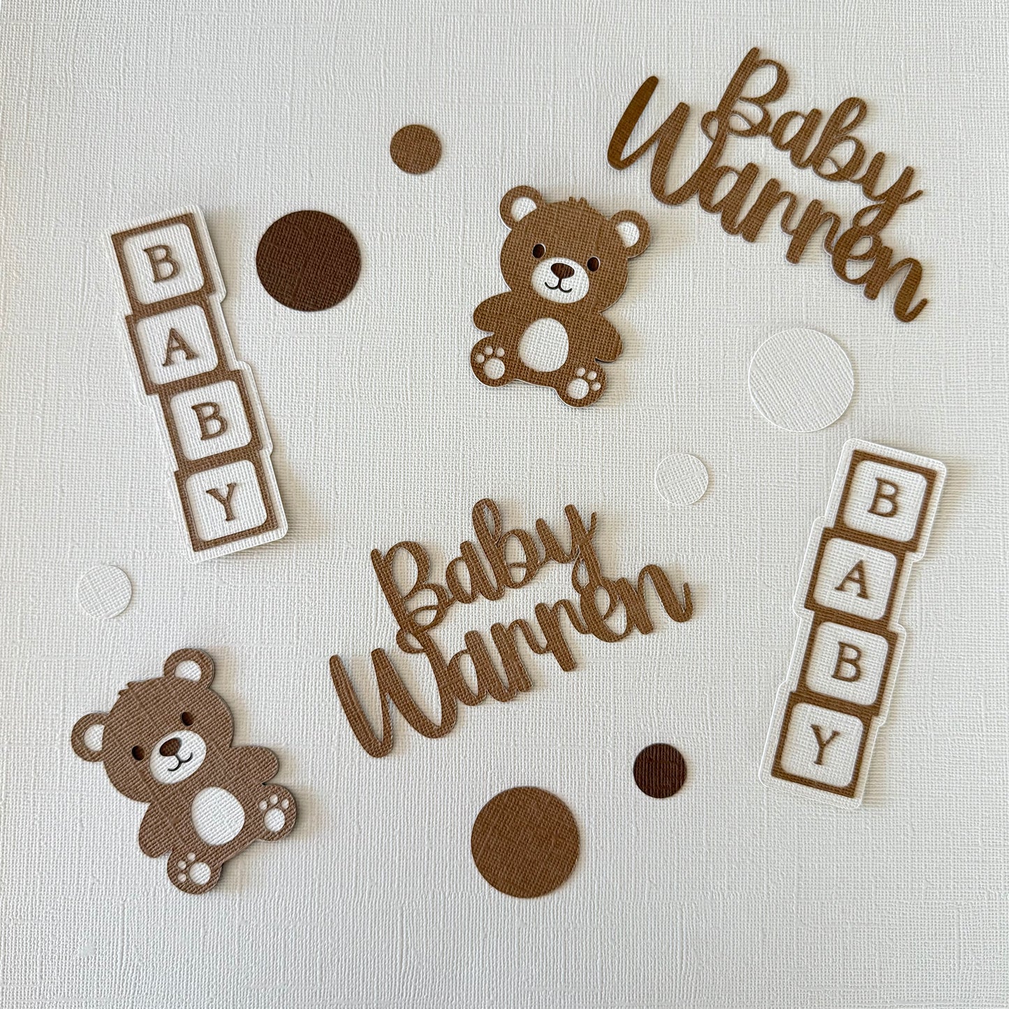 Decorative elements for a baby-themed design with teddy bears and 'Baby Warren' text on a light background.