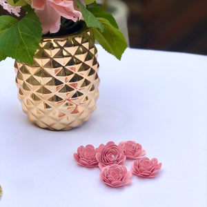 pink rolled paper flowers